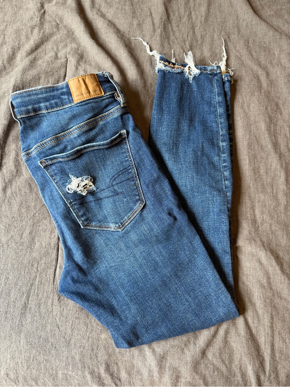 American Eagle Outfitters Blue Distressed Skinny Jeans with Frayed Hem